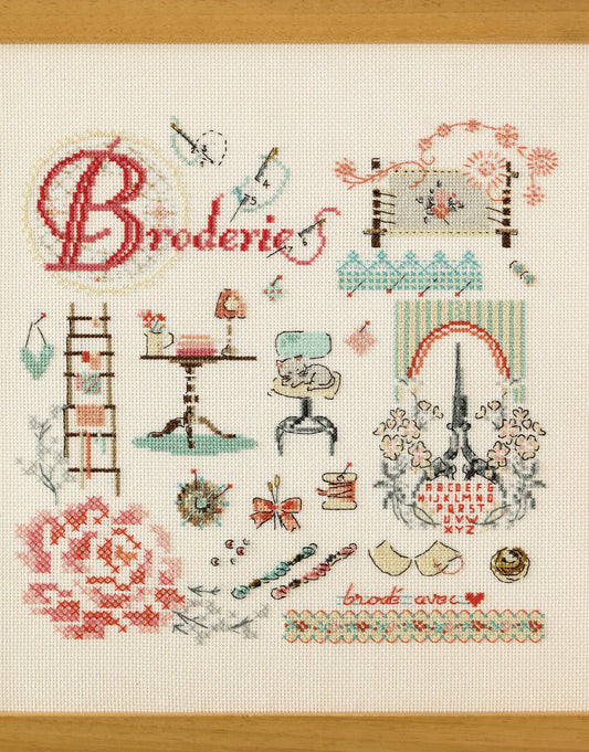 Grille de point de croix L'atelier broderie : tableau d'atelier sur Aïda 5,5 blanc. 150 x 152 points. Références DMC sur 4 pages.