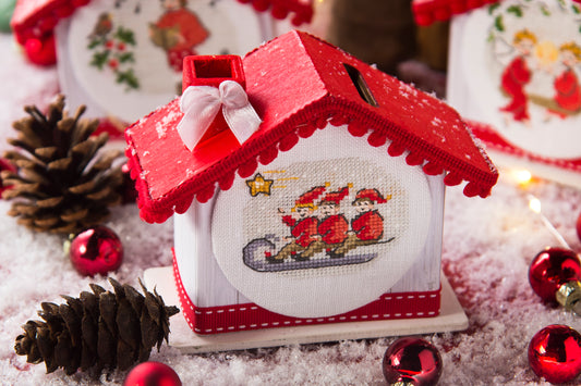 Grille point de croix : maisons de Noël à broder en tirelires décoratives. 5 motifs, 6 pages DMC, sur lin ou Aïda. Un cadeau fait main plein de charme.