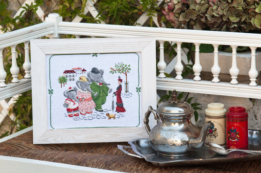 12 grilles broderie point de croix : collection Babar en famille par Véronique Enginger. Scènes 22 à 31 cm. Lin 11 fils/cm. Magazine 52 pages, symboles DMC.