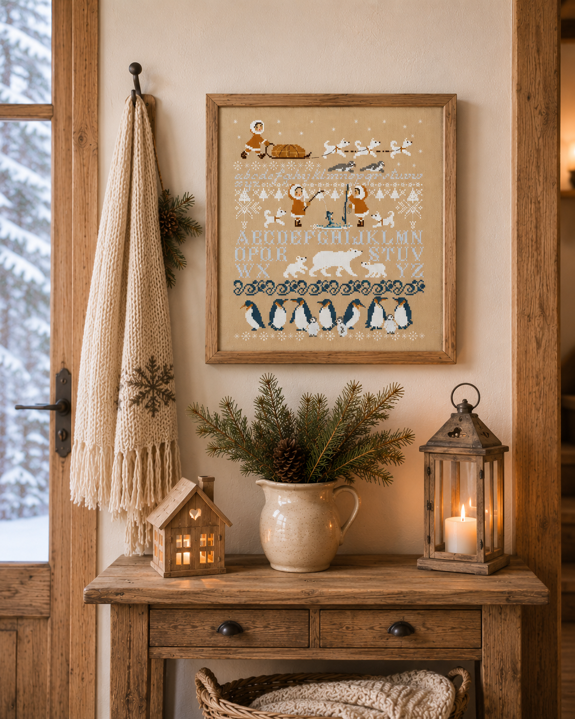 Grille point de croix de Perrette Samouïloff : alphabet banquise avec igloos, ours blancs et pingouins, 150x173 pts. Broderie hivernale pleine de poésie.