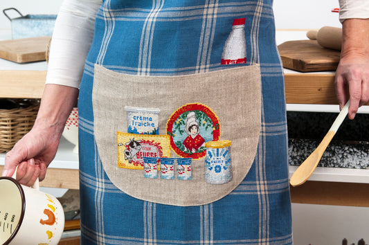 Grille broderie point de croix : Bretonne produits laitiers a broder sur lin bis. Torchon ou tablier, DMC, 6 pages.