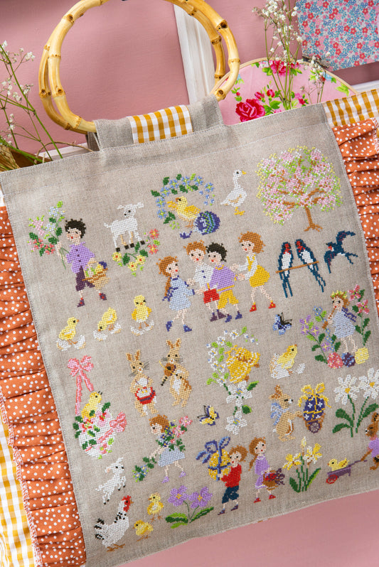 Grille de broderie point de croix : Pâques dans mon sac, grand sac printanier par H. Le Berre. Réf. DMC incluse. À broder sur lin bis. Création Point de Croix.