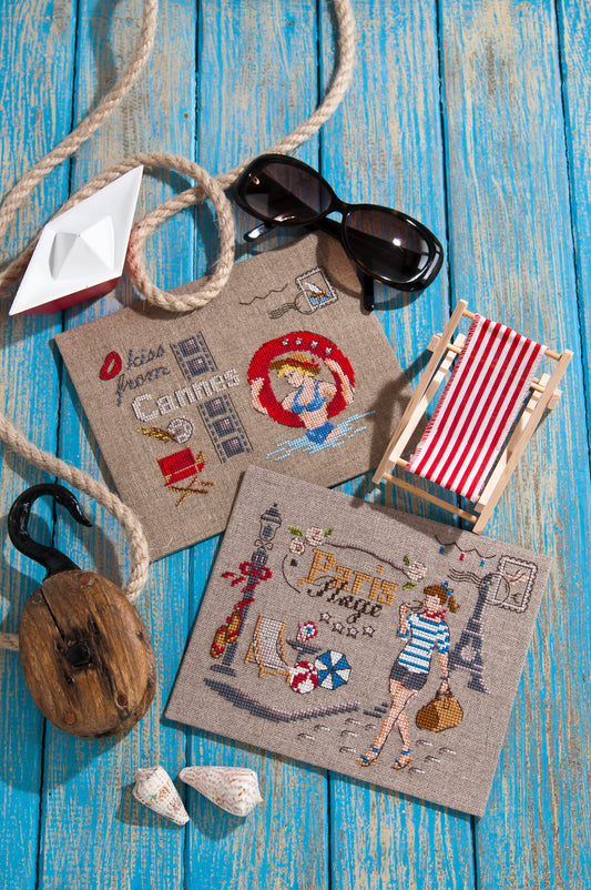 Grille broderie point de croix : cartes postales Paris et Cannes. 4 pages, symboles et couleurs DMC. Lin 11 fils blanc.