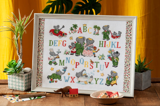 Grille point de croix : tableau ABC de Babar sur lin DMC. Motif 172×138 pts, env. 31×25 cm. Imprimé symboles & couleurs, 6 pages.