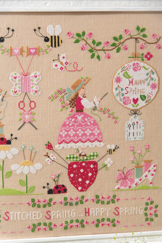Grille point de croix : scène printanière, brodeuse, abeilles et fleurs. 210×240 pts, lin 12 fils/cm ou Aïda 6 pts/cm. 6 pages couleur, réf. DMC.